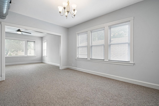 5043 W Argyle St, Chicago, IL 60630 - carpeted spare room featuring healthy amount of natural light, a chandelier, and a ceiling fan