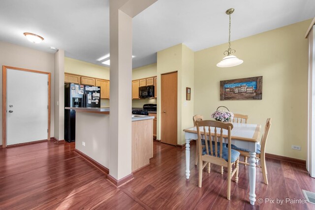 937 Emerald Dr, Pingree Grove, IL 60140 - kitchen with black appliances, dark wood-style floors, pendant lighting, a center island, and light brown cabinetry