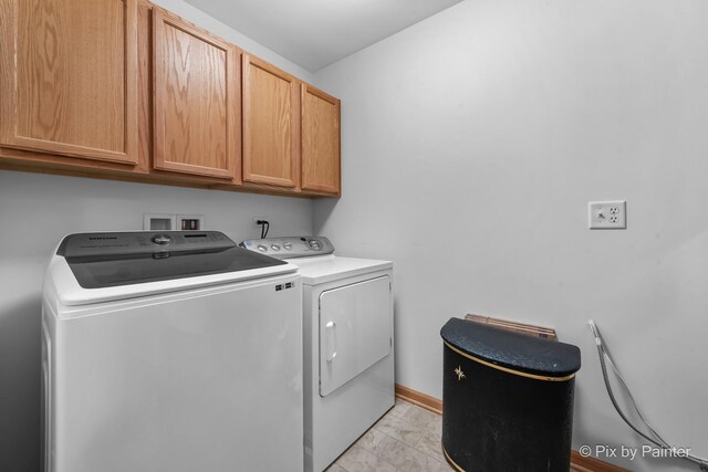 937 Emerald Dr, Pingree Grove, IL 60140 - laundry area featuring cabinet space, washer and clothes dryer, and light marble finish flooring