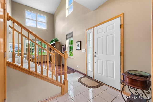 937 Emerald Dr, Pingree Grove, IL 60140 - foyer with stairway, tile patterned floors, and a high ceiling
