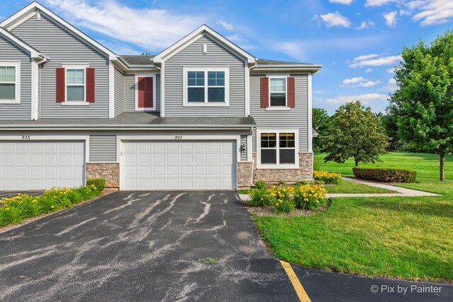937 Emerald Dr, Pingree Grove, IL 60140 - townhome / multi-family property featuring stone siding, a front yard, an attached garage, and asphalt driveway