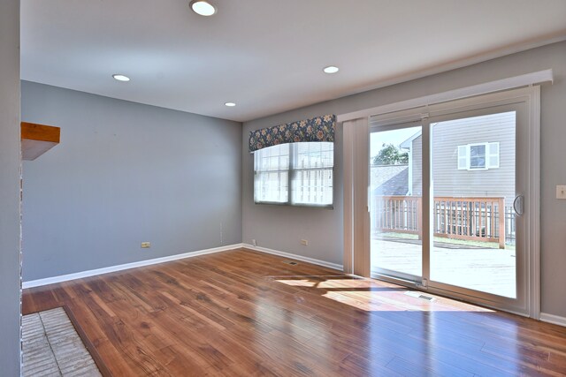 633 Ascot Ln, Streamwood, IL 60107 - empty room featuring wood finished floors and recessed lighting