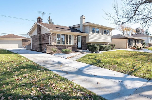 507 Wingate Dr, Schaumburg, IL 60193 - split level home with brick siding, a chimney, a front lawn, and an outbuilding