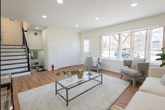 507 Wingate Dr, Schaumburg, IL 60193 - living room with wood finished floors, stairs, and recessed lighting