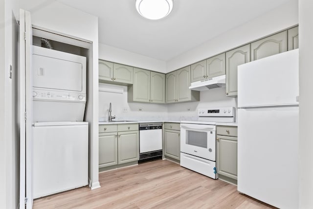 124 Klein Creek Ct Unit 5E, Carol Stream, IL 60188 - kitchen featuring white appliances, stacked washing machine and dryer, under cabinet range hood, green cabinetry, and light wood finished floors
