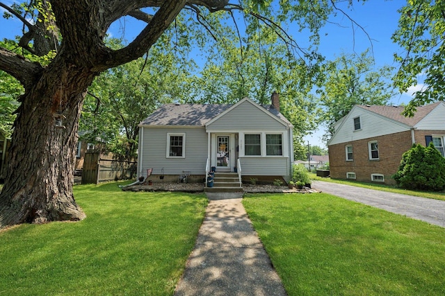 21207 Locust St, Matteson, IL 60443 - bungalow-style house with a chimney and asphalt driveway