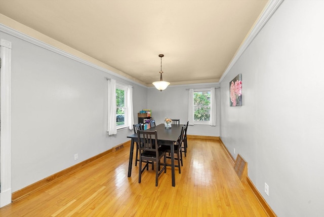 21207 Locust St, Matteson, IL 60443 - dining space with healthy amount of natural light, light wood-style flooring, and ornamental molding