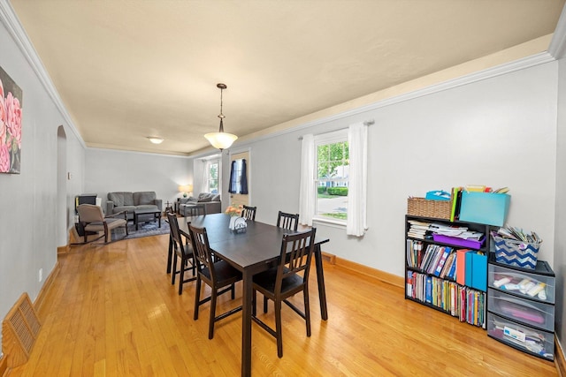 21207 Locust St, Matteson, IL 60443 - dining space featuring ornamental molding and light wood-style flooring