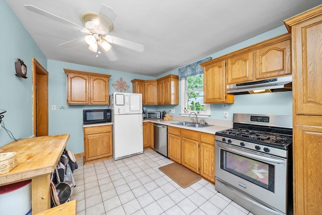 21207 Locust St, Matteson, IL 60443 - kitchen featuring appliances with stainless steel finishes, under cabinet range hood, light countertops, ceiling fan, and brown cabinetry