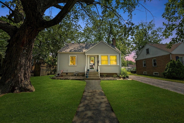 21207 Locust St, Matteson, IL 60443 - bungalow with concrete driveway and a chimney