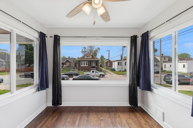 334 153rd St, Calumet City, IL 60409 - spare room featuring ceiling fan, wood finished floors, and a residential view