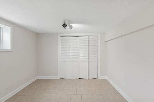 334 153rd St, Calumet City, IL 60409 - unfurnished bedroom featuring a closet and baseboards