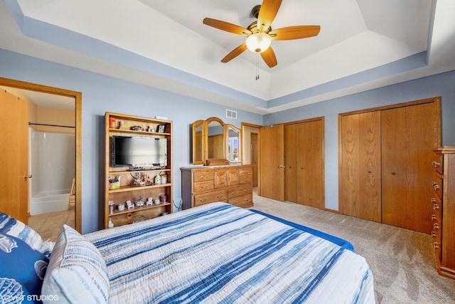 1908 Chestnut Hill Rd, Plainfield, IL 60586 - carpeted bedroom with a raised ceiling, multiple closets, ceiling fan, and connected bathroom