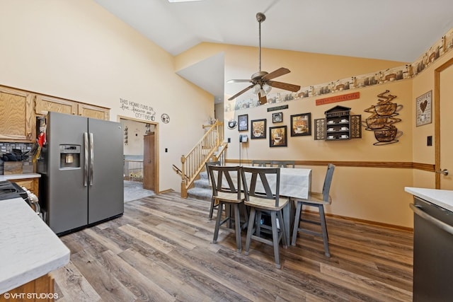 1908 Chestnut Hill Rd, Plainfield, IL 60586 - dining room featuring wood finished floors, a ceiling fan, stairway, and high vaulted ceiling