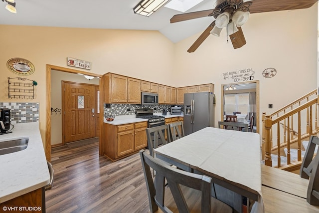 1908 Chestnut Hill Rd, Plainfield, IL 60586 - kitchen featuring backsplash, appliances with stainless steel finishes, a ceiling fan, high vaulted ceiling, and wood finished floors
