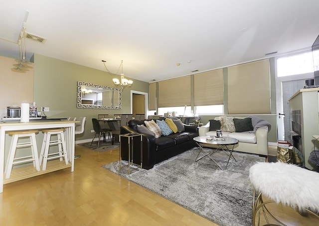 1621 S Halsted St Unit 405, Chicago, IL 60608 - living area with a chandelier and wood finished floors