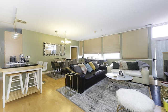 1621 S Halsted St Unit 405, Chicago, IL 60608 - living room with light wood-style floors and a chandelier