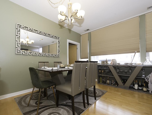 1621 S Halsted St Unit 405, Chicago, IL 60608 - dining space with a chandelier and wood finished floors