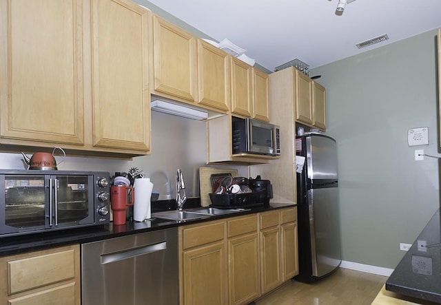 1621 S Halsted St Unit 405, Chicago, IL 60608 - kitchen featuring appliances with stainless steel finishes, light brown cabinets, and light wood finished floors