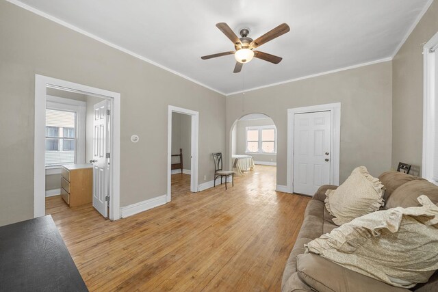 5938 S La Salle St, Chicago, IL 60621 - living room with arched walkways, ceiling fan, light wood finished floors, and crown molding
