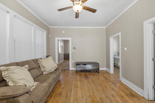 5938 S La Salle St, Chicago, IL 60621 - living room featuring a ceiling fan, ornamental molding, and light wood finished floors