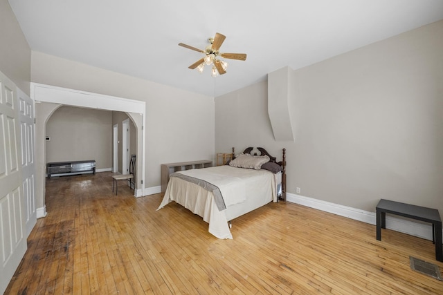 5938 S La Salle St, Chicago, IL 60621 - bedroom with hardwood / wood-style flooring, arched walkways, and ceiling fan