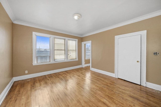 5938 S La Salle St, Chicago, IL 60621 - spare room with crown molding and light wood finished floors