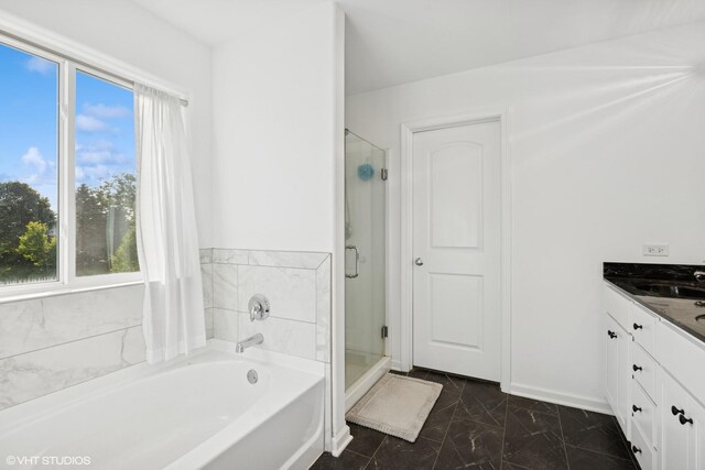 10831 Partridge Trl, Richmond, IL 60071 - bathroom featuring a garden tub, marble look tile flooring, healthy amount of natural light, and a shower stall