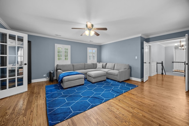 3 Old Valley Rd, Rolling Meadows, IL 60008 - living room featuring wood finished floors, ceiling fan, ornamental molding, and a chandelier