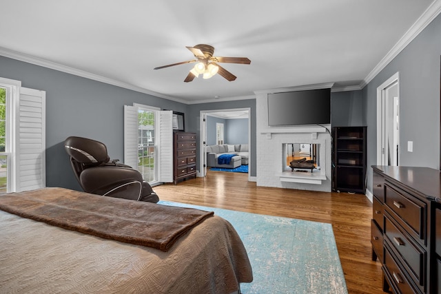 3 Old Valley Rd, Rolling Meadows, IL 60008 - bedroom featuring crown molding, wood finished floors, ceiling fan, and a brick fireplace