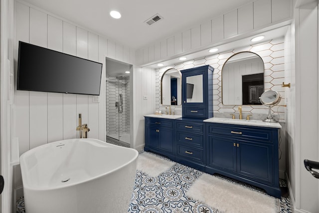 3 Old Valley Rd, Rolling Meadows, IL 60008 - full bathroom with double vanity, a shower stall, a freestanding bath, backsplash, and recessed lighting
