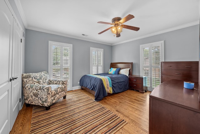 3 Old Valley Rd, Rolling Meadows, IL 60008 - bedroom featuring light wood-style floors, multiple windows, crown molding, and a ceiling fan