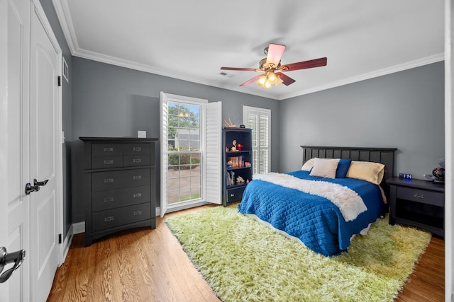 3 Old Valley Rd, Rolling Meadows, IL 60008 - bedroom with ornamental molding, wood finished floors, ceiling fan, and a closet