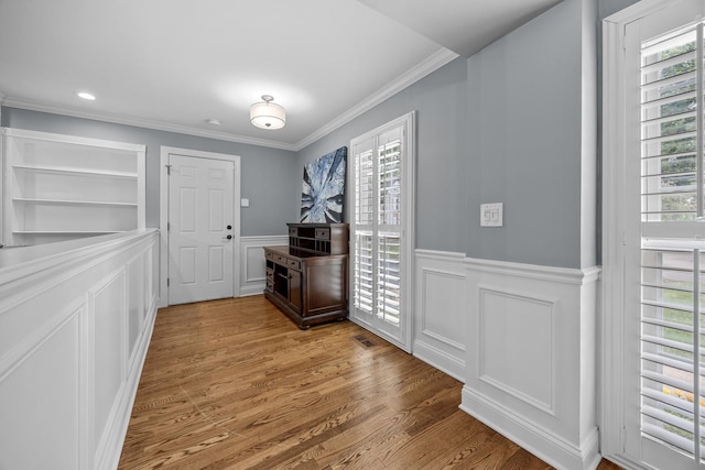 3 Old Valley Rd, Rolling Meadows, IL 60008 - entryway featuring ornamental molding, a decorative wall, a wainscoted wall, and wood finished floors