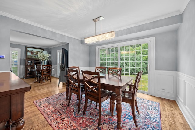 3 Old Valley Rd, Rolling Meadows, IL 60008 - dining area with ornamental molding, light wood-type flooring, wainscoting, and a decorative wall