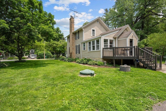 32W167 Army Trail Rd, Wayne, IL 60184 - back of house with a chimney, a wooden deck, stairs, and a yard