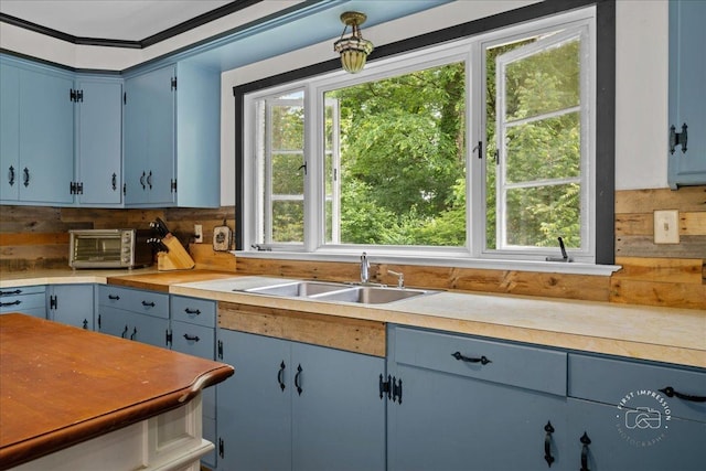 32W167 Army Trail Rd, Wayne, IL 60184 - kitchen with blue cabinetry, backsplash, and light countertops