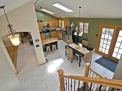9417 W Steger Rd, Frankfort, IL 60423 - dining area with vaulted ceiling and light tile patterned floors