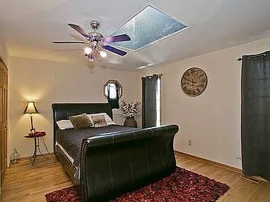 9417 W Steger Rd, Frankfort, IL 60423 - bedroom featuring wood finished floors and ceiling fan