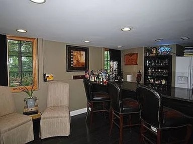 9417 W Steger Rd, Frankfort, IL 60423 - indoor dry bar with recessed lighting, dark wood-type flooring, and refrigerator with ice dispenser