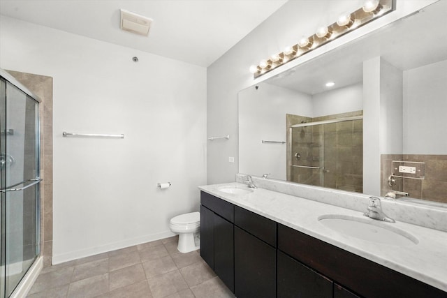 3963 W Belmont Ave Unit 613, Chicago, IL 60618 - bathroom featuring a shower stall, double vanity, and tile patterned flooring