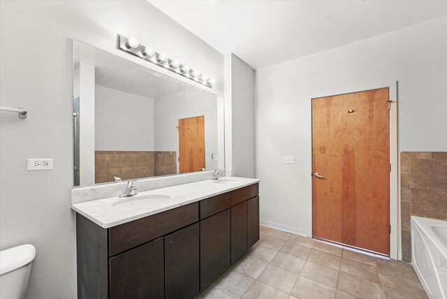 3963 W Belmont Ave Unit 613, Chicago, IL 60618 - full bath with a garden tub, tile patterned flooring, and double vanity