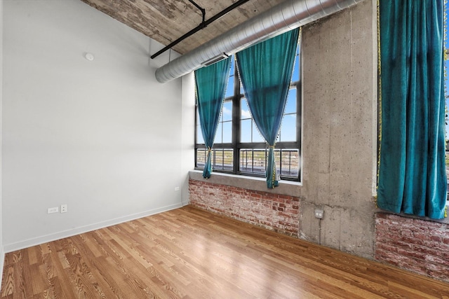 3963 W Belmont Ave Unit 613, Chicago, IL 60618 - unfurnished room featuring wood finished floors and baseboards