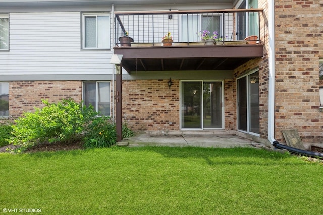 330 Memory Ln Unit 2, Westmont, IL 60559 - rear view of property featuring a balcony, a lawn, brick siding, and a patio area