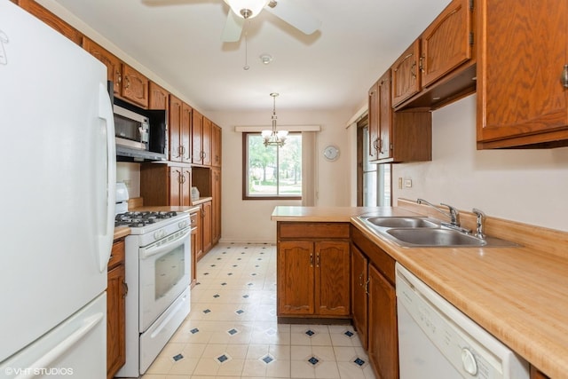 330 Memory Ln Unit 2, Westmont, IL 60559 - kitchen with white appliances, a ceiling fan, brown cabinets, and light countertops