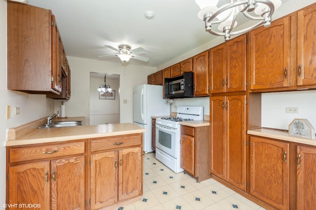 330 Memory Ln Unit 2, Westmont, IL 60559 - kitchen with white appliances, a chandelier, brown cabinetry, and light countertops