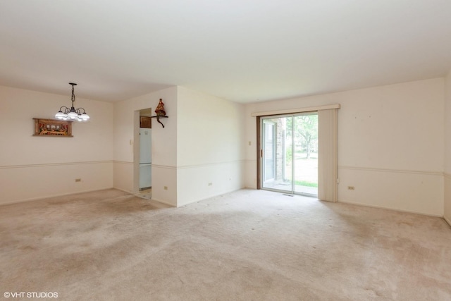 330 Memory Ln Unit 2, Westmont, IL 60559 - empty room featuring light carpet and a chandelier