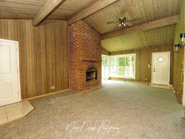 837 Wilcox Ave, Mundelein, IL 60060 - unfurnished living room featuring wooden walls, ceiling fan, a brick fireplace, wooden ceiling, and carpet