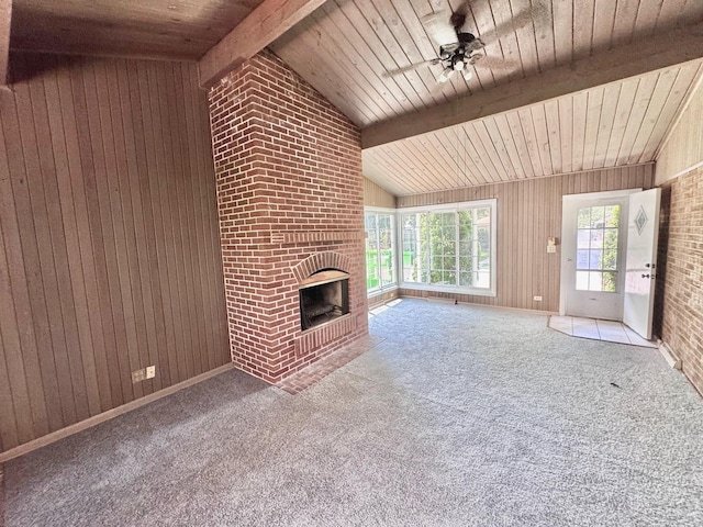 837 Wilcox Ave, Mundelein, IL 60060 - unfurnished living room featuring wooden ceiling, a ceiling fan, wood walls, a fireplace, and carpet