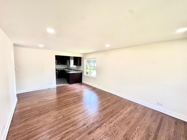 837 Wilcox Ave, Mundelein, IL 60060 - unfurnished living room with wood finished floors and recessed lighting